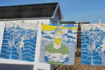 Tea towel sea set on a washing line with beach in background