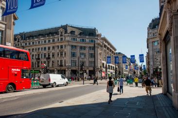 Shoppers on Oxford Street and a double decker bus on the left