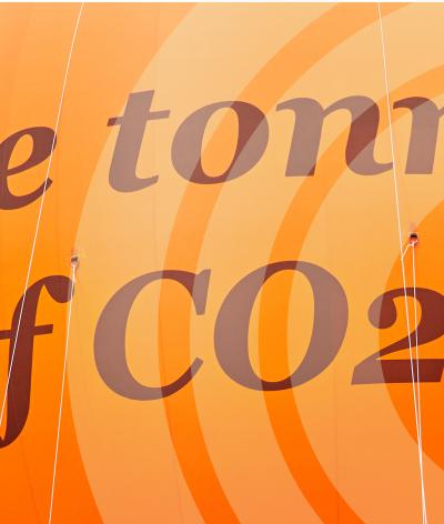 A large orange bubble that represents one tonne of carbon dioxide