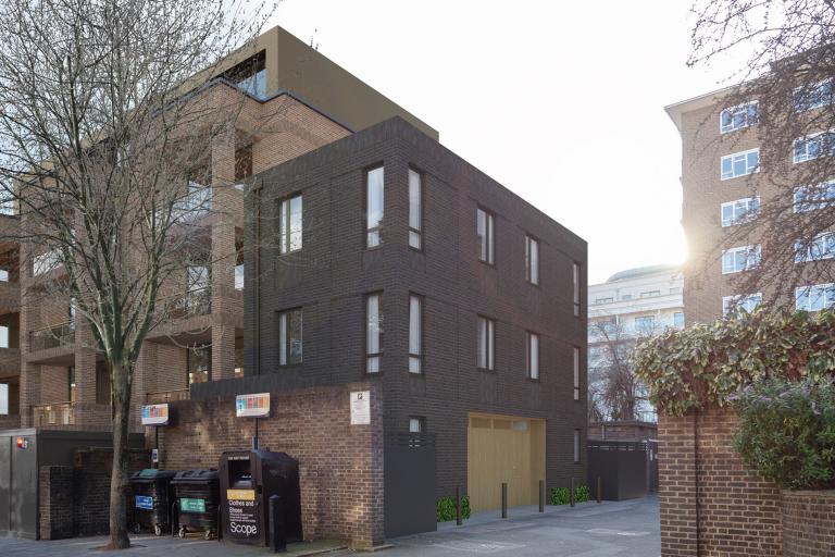 An artist's impression of what the Cochrane Street project could look like - it is a block of two houses built with dark brick and windows covering all sides of the building