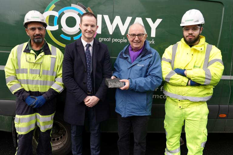 Cllr Dimoldenberg meeting the team at FM Conway with a piece of recycled road