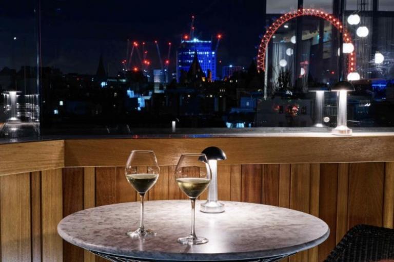 A rooftop bar with a view onto the thames and of the London Eye