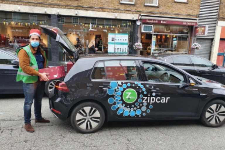 Westminster City Council volunteer using zipcar to deliver christmas hamper
