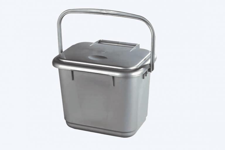 A small silver bin used for food waste