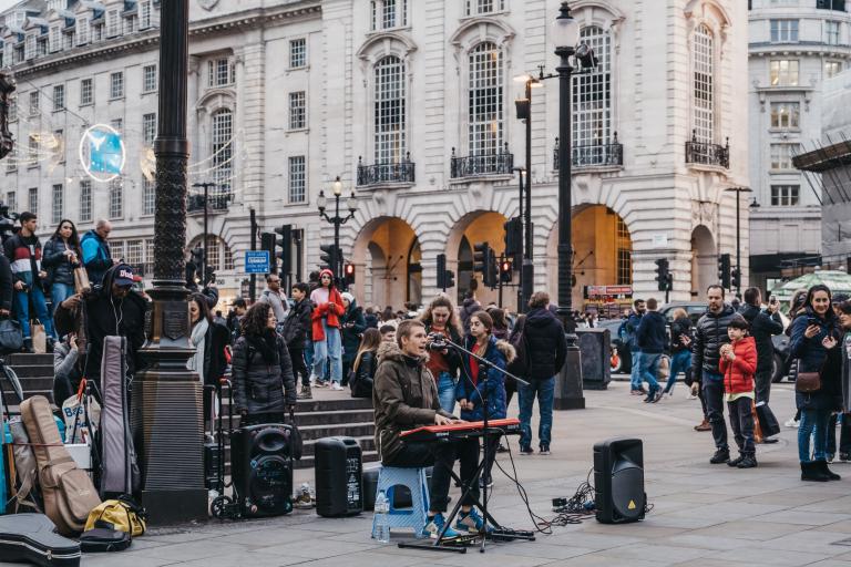 istock image of busker in Piccadilly Circus