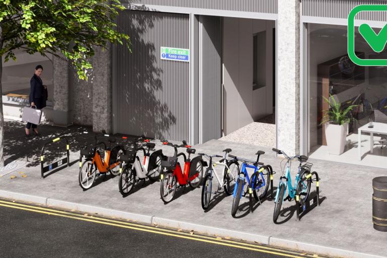 A CGI example of dockless bike parking on a pavement between two black arched barriers with a bike symbol on them
