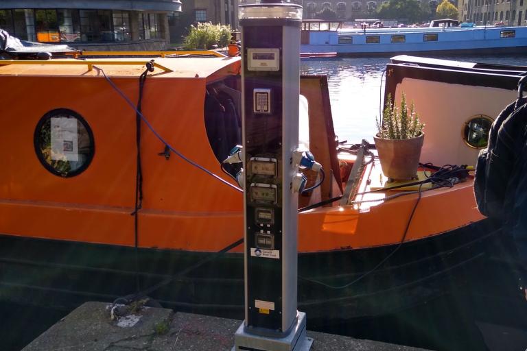 An electricity charging point on a canal