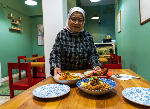 Bayswater local Normah serving food in her small restaurant