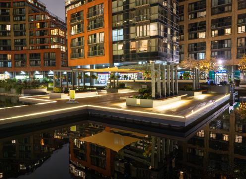 A night time photo of the public space around Paddington Canal