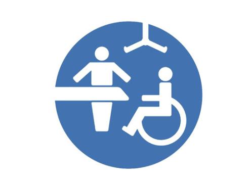 Blue and white changing places logo of a person standing behind a changing table, a person in a wheelchair and a hoist.