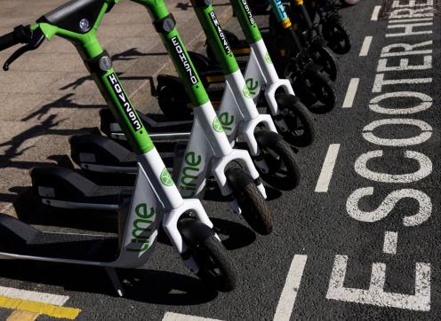 image of a line of e-scooters