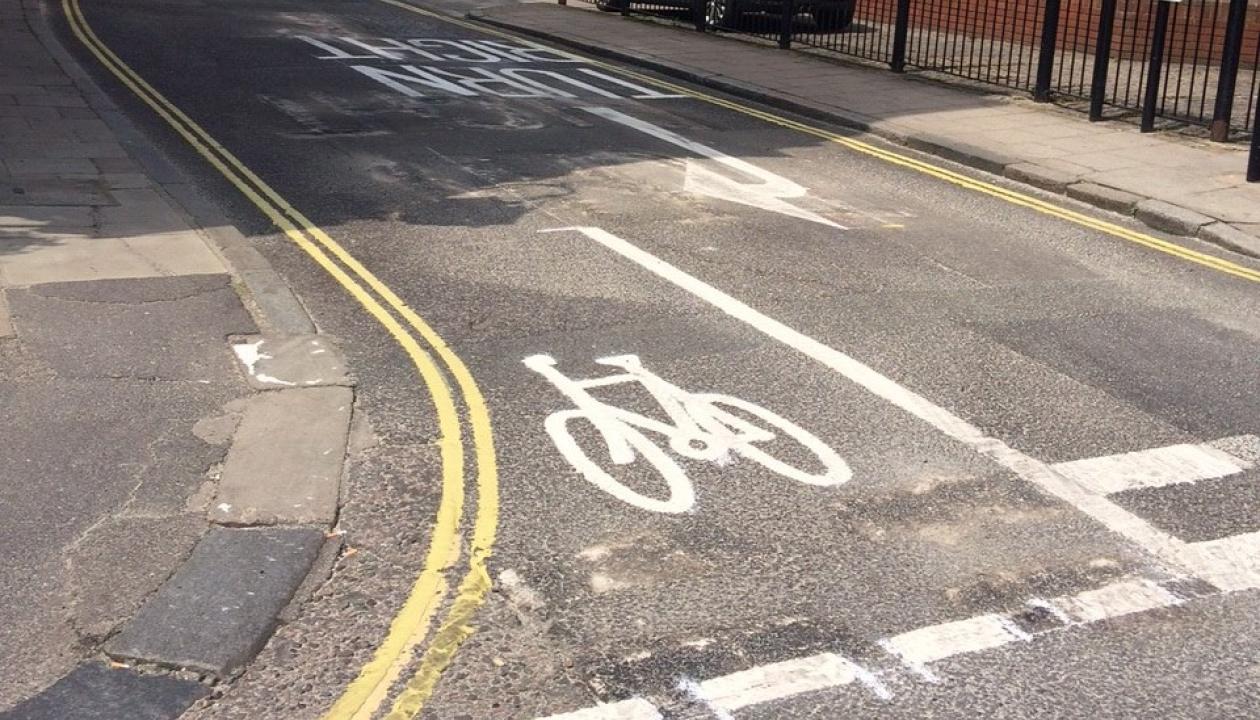 A painted cycle lane that has been added to a junction of a road