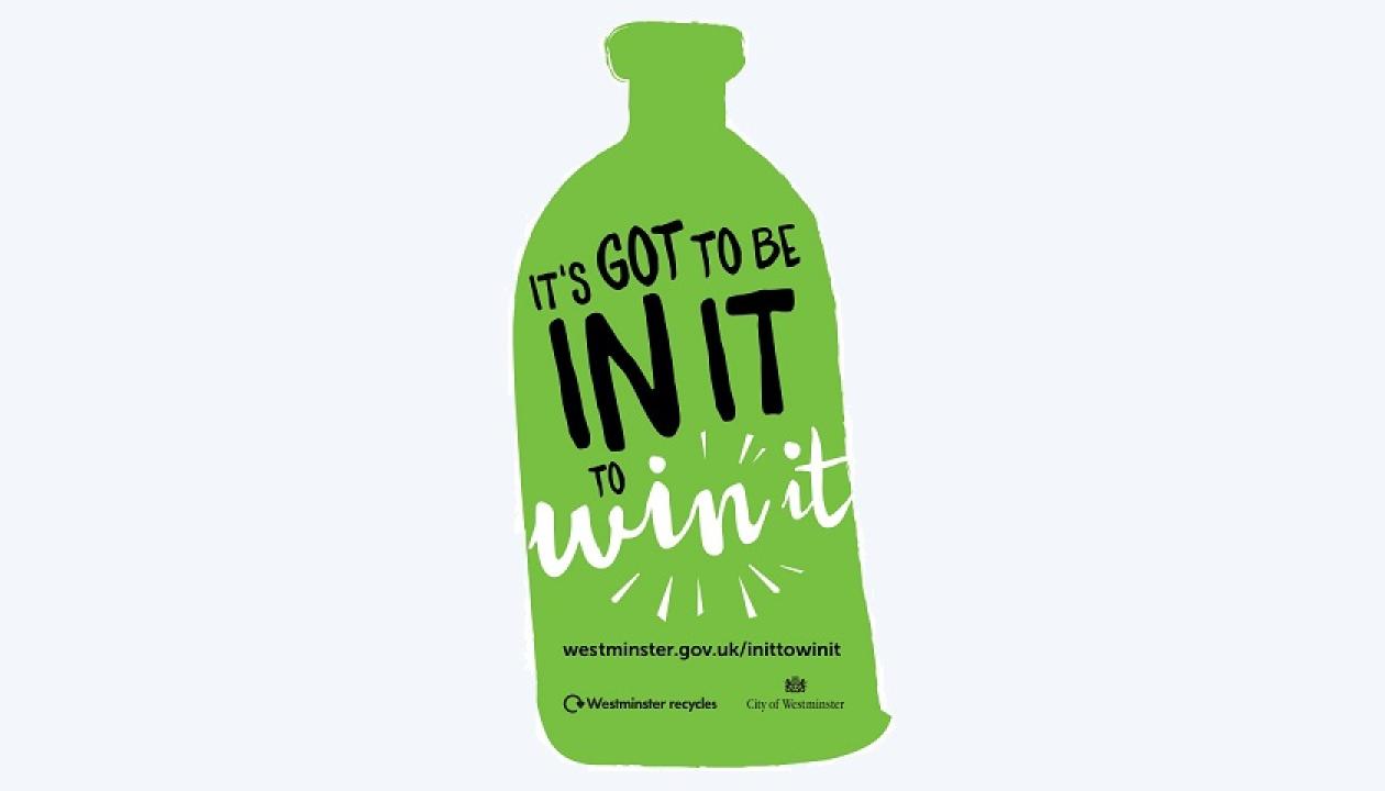 An In it to Win It sticker, in the shape of a green bottle with the words 'in it to win it' on it.